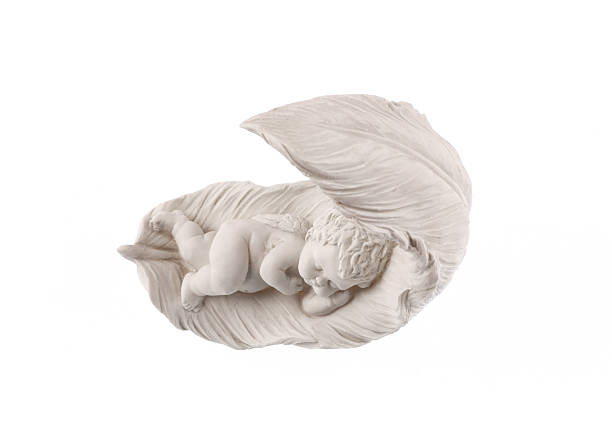 Sleeping angel figurine isolated on white background