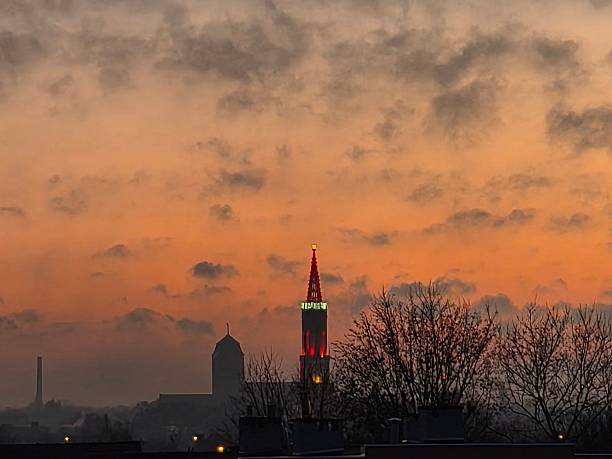 Żagań, Poland. The photo shows the tower of the Evangelical church in Żagań decorated with a Santa Claus hat. Thanks to these decorations, the tower is visible from every part of the city. The church tower is decorated like this every year.