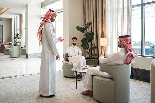 istock Middle Eastern Executives Having Business Discussion In Luxury Hotel Lounge 2249585297