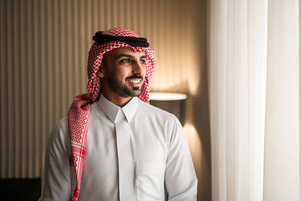 istock Confident Middle Eastern Professional In Traditional Keffiyeh Standing By Window With Warm Natural Light 2249585408