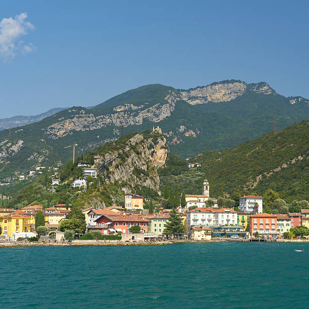 View of Nago-Torbole with the districts of Nago and Torbole Sul Garda on Lake Garda in Italy from the water