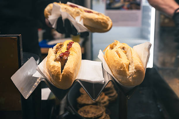 istock Chef Preparing Hot Dog at Christmas Fair 2249589376