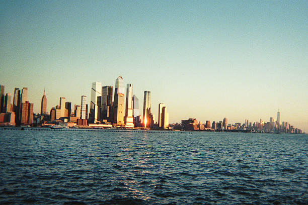istock Panoramic golden hour skyline view of Manhattan from a waterfront vantage point 2249592565
