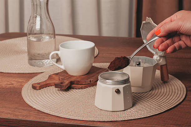 istock Preparing coffee with a moka pot and fresh ground coffee on a wooden table 2249594385