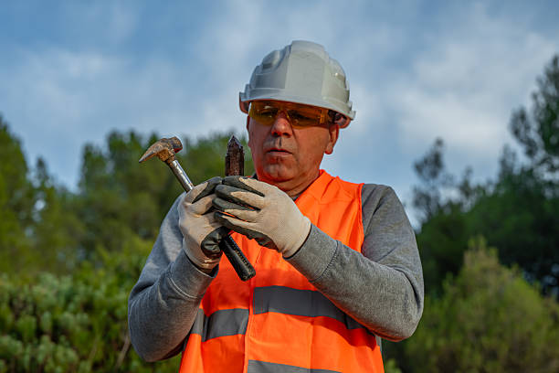 Geologist showing a citrine quartz crystal, extracted from an open-pit quarry. Mineral prospecting with tools, hammer... a precious piece of mineral. Winter geology. Tordesillas, Valladolid, Castile and León, Spain, Europe - November 12, 2025.