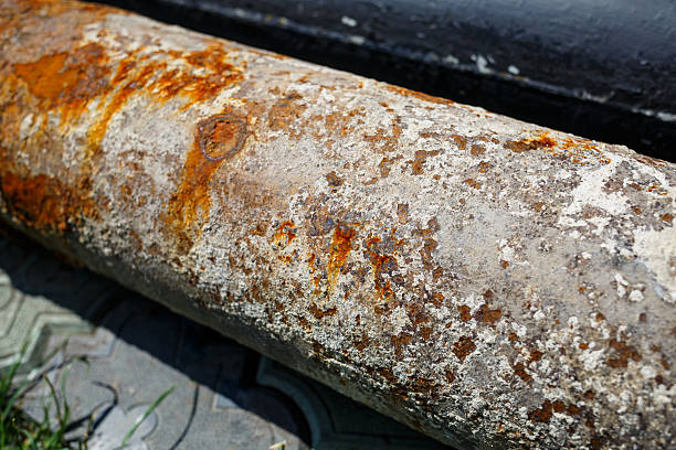 istock a large metal rusty pipe lies on concrete 2249605455