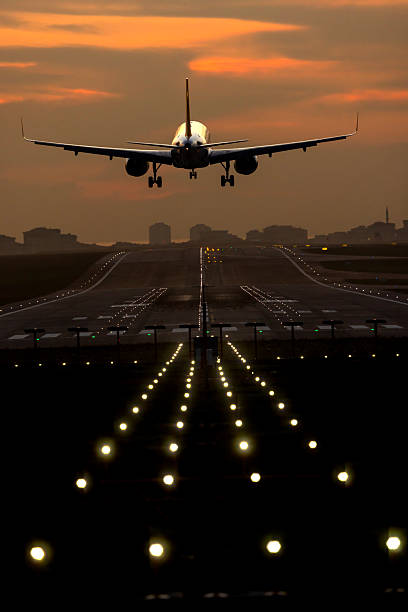 istock Passenger airplane landing at sunset 2249607145