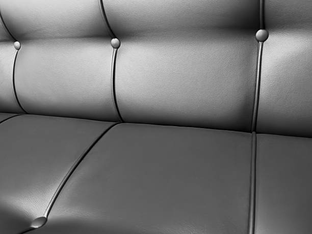 istock Leather sofa texture background. Modern furniture. Black leather Sofa 2249607419