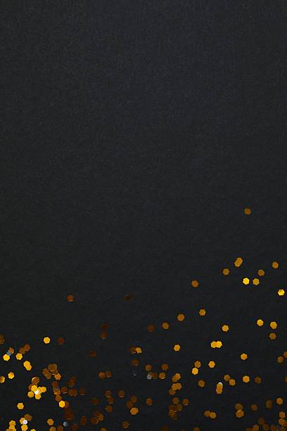 istock Golden confetti on black background, top view 2249607683