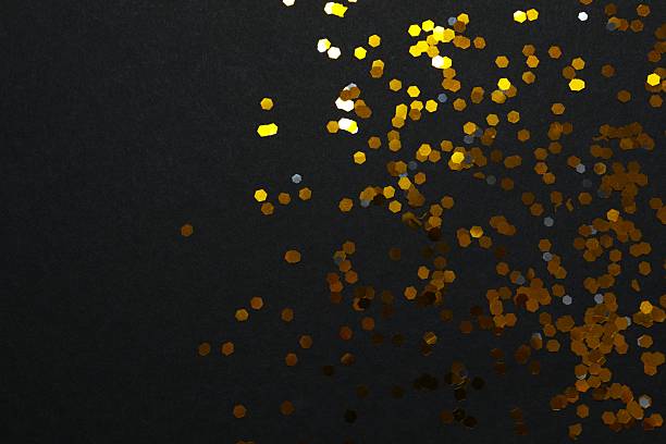 istock Golden confetti on black background, top view 2249607698