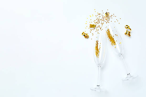 istock White festive background with champagne glasses and confetti 2249607748
