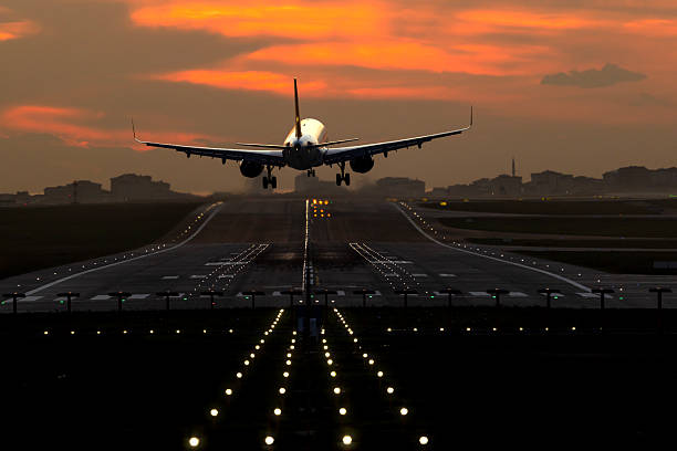 istock Passenger airplane landing at dusk 2249609298