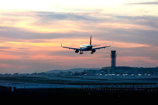 istock Passenger airplane landing at dusk 2249609313