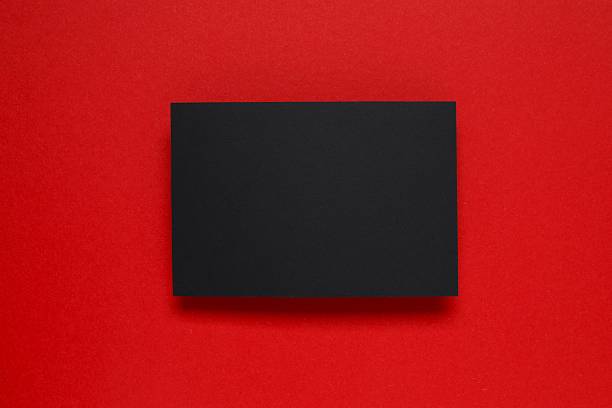 istock Black paper card on color background 2249610385