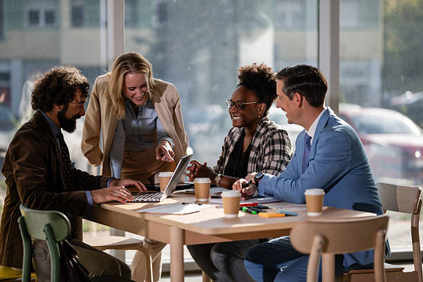 istock Diverse business team collaborating and laughing during meeting 2249611172