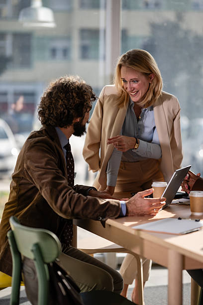 istock Business colleagues collaborating on digital tablet in office 2249611254