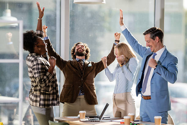 istock Diverse business team celebrating success and achievement in office 2249611574