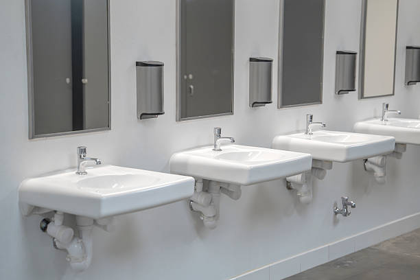 istock sinks in a row in public bathroom 2249611913