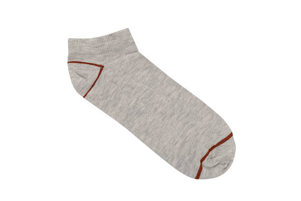 istock One sock isolated on white background. Sock on white background. Colored socks on the leg isolated 2249614599
