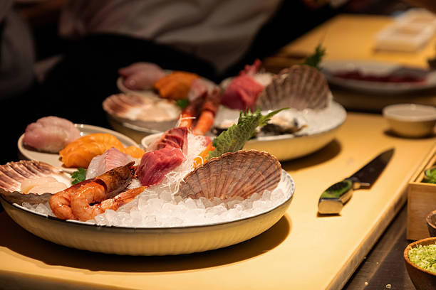 istock Fresh seafood platter with assorted sushi and shellfish on ice display 2249619235