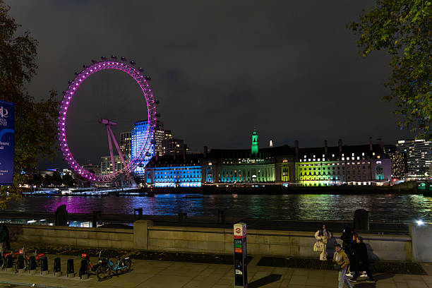 London United Kingdom on December 20, 2025. The London eye ferrys wheel from the banks of the Thames river. Night view.