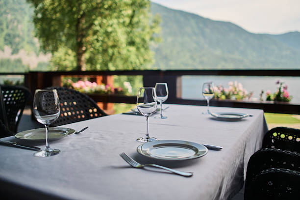 istock served table with burning candles and fresh flowers for a festive dinner. 2249624458
