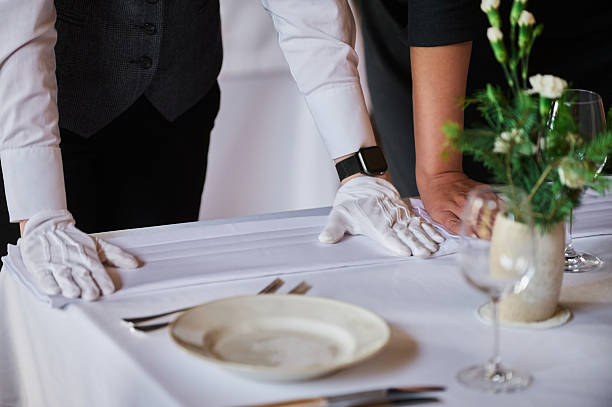 istock Restaurant personnel preparing the fine dining table. 2249624460