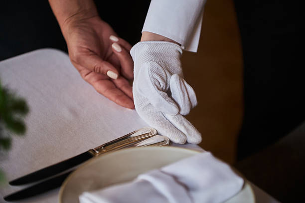istock Restaurant personnel preparing the fine dining table. 2249624461