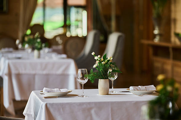 istock served table with burning candles and fresh flowers for a festive dinner. 2249624462