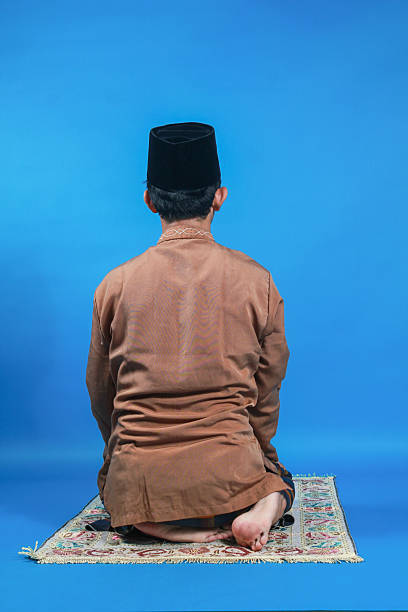 istock Religius Muslim man worships indoors 2249634138