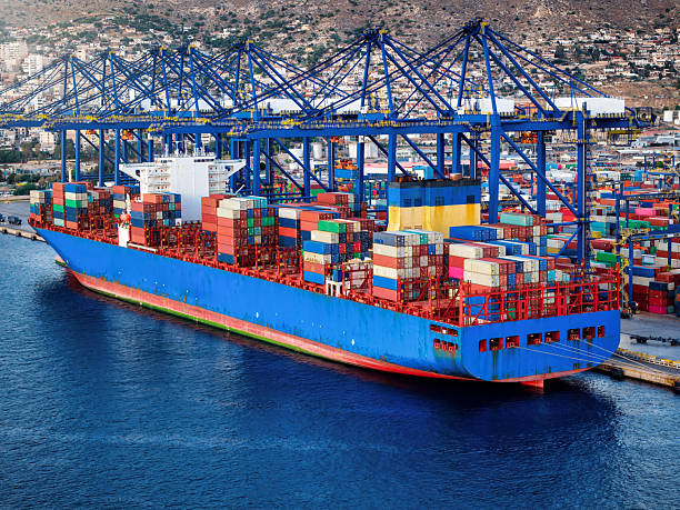 istock Aerial view of a super container ship docked at a commercial terminal harbour 2249635493