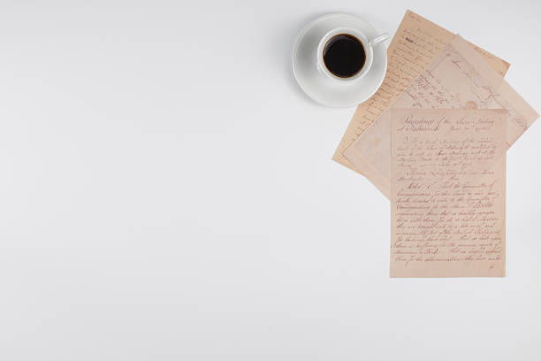 Top view coffee cup with letters on white background with copy space. High quality photo