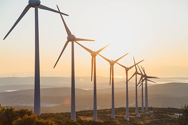 istock Wind Turbines Sunset — Renewable Energy Landscape at Dusk 2249636157