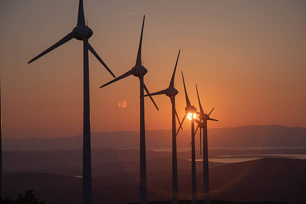 istock Wind Turbines Sunset — Renewable Energy Landscape at Dusk 2249636199