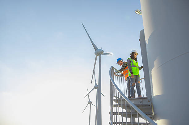 istock Renewable Energy Engineers Collaborating on Wind Turbine Operations with Digital Tablet 2249636258