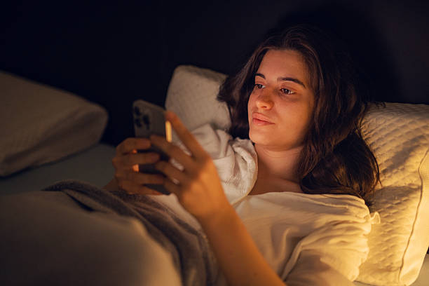 istock Woman using smart phone at home. 2249639916