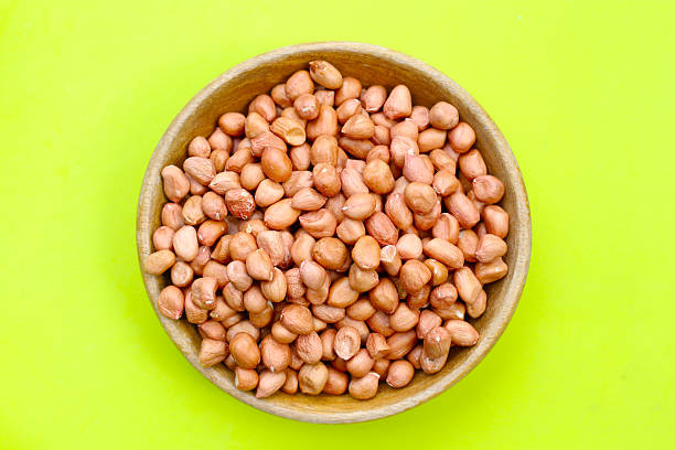 istock Raw, shelled peanuts in wooden bowl 2249640166