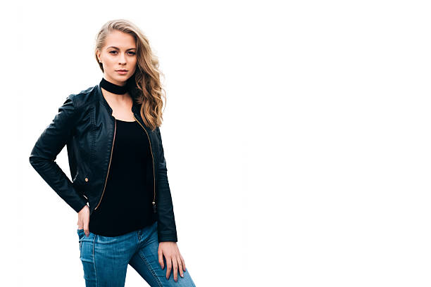 Studio shot of an attractive young woman pushing the wall