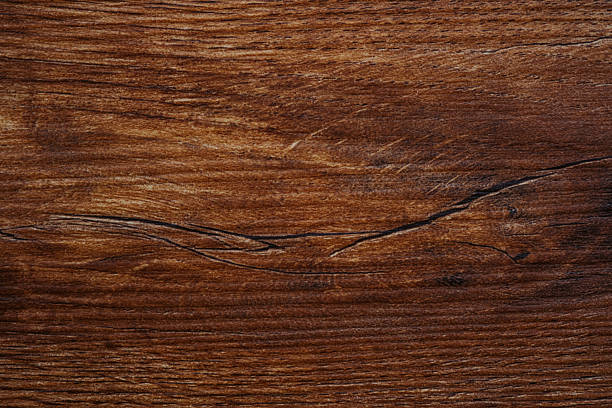 istock Close-up of vertical wood  texture with rich warm brown tone and deep lines 2249640468