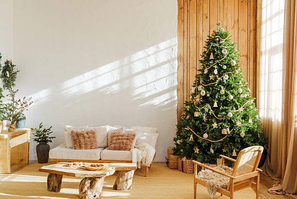 istock Cozy living room with decorated Christmas tree, sofa, and natural light streaming in. 2249640622