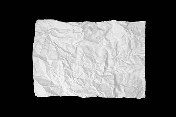 Top-view image of a white, heavily wrinkled sheet of paper placed against a solid black background. The creases and irregular folds create a strong textural contrast. The minimalist composition evokes concepts of discarded ideas, imperfection, and creativity.