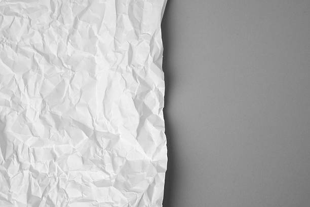 istock Wrinkled paper texture on white background 2249640648