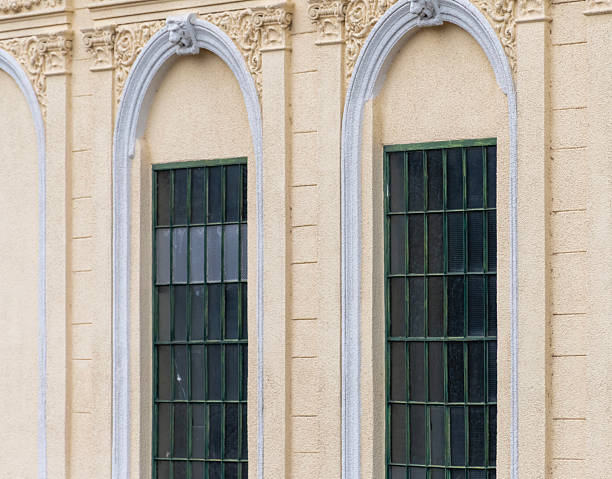 istock Facade of a classical building with arched windows and decorative stucco in a historical architectural style 2249643433