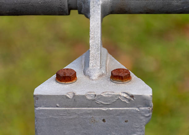 istock Two bolts with heavy corrosion on a metal corner element of the structure 2249643501