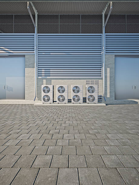 istock 3d rendering of industrial cooling infrastructure. Condenser units outside building. HVAC utility systems for heat ventilation and climate control. Concept of refrigeration engineering. 2249645003