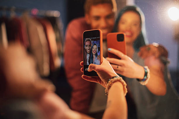 istock Bright Selfie Moment With Friends Taking Group Photo In Dressing Room Mirror 2249647672