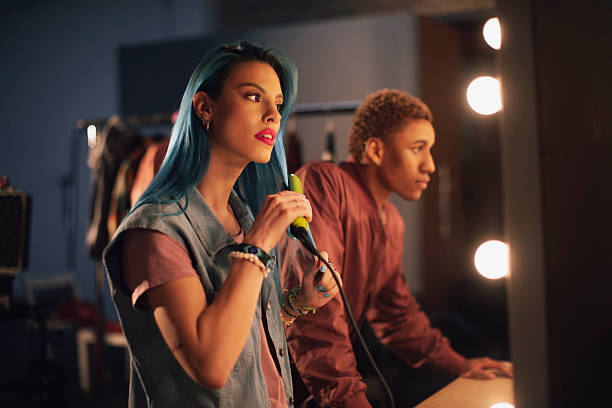istock Backstage Music Performance: Female Singer With Blue Hair Preparing to Perform on Stage 2249647675