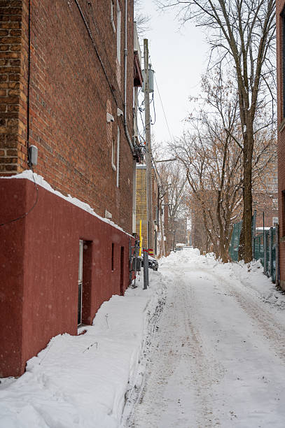 Snowy alley in Quebec city during winter day