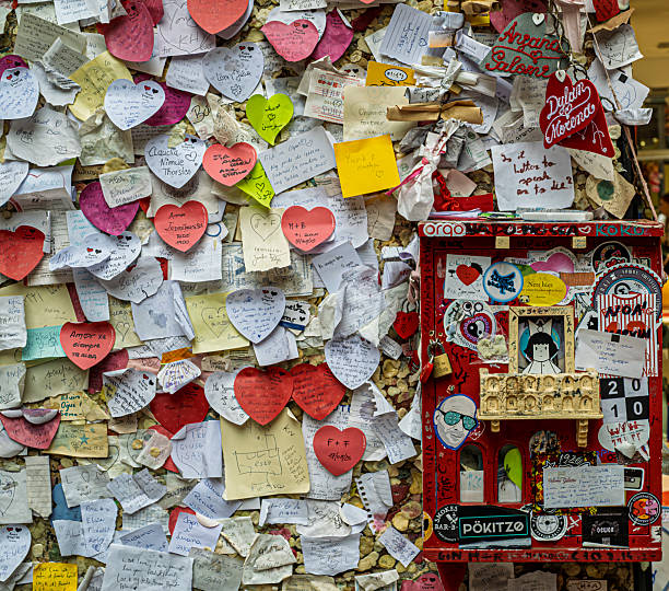 Verona, Veneto, Italy. August 23, 2025. The wall where the visitors put their messages to the fomous couple of fallen in love. Courtyard of Capuleti house.