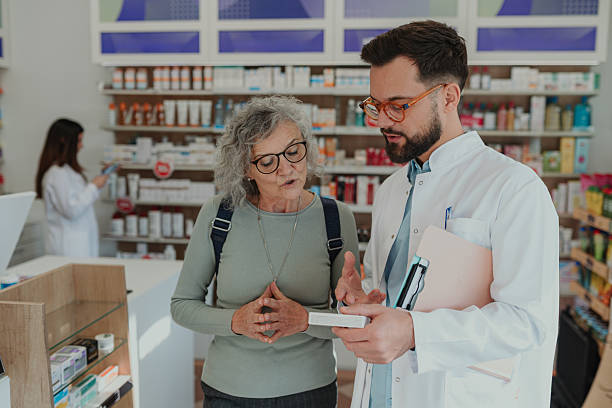 istock Pharmacist explaining medication to senior customer in drug store 2249648334